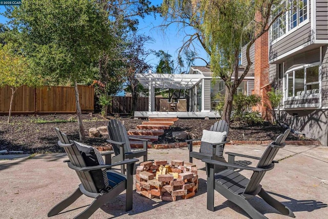 view of patio / terrace featuring a pergola and an outdoor fire pit