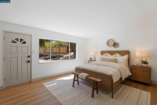 bedroom with hardwood / wood-style flooring