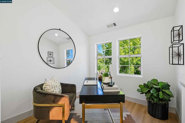 office area with light hardwood / wood-style floors