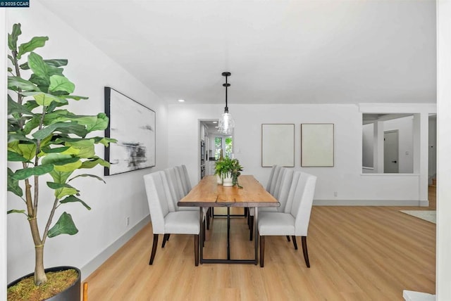 dining room with light hardwood / wood-style flooring