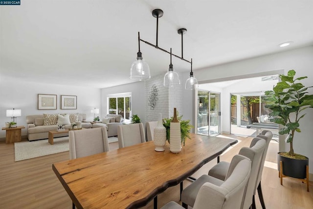 dining space featuring light wood-type flooring