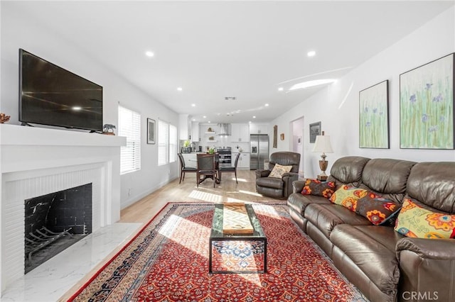 living room with a premium fireplace