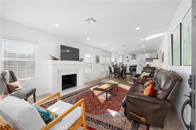 living room with light hardwood / wood-style flooring