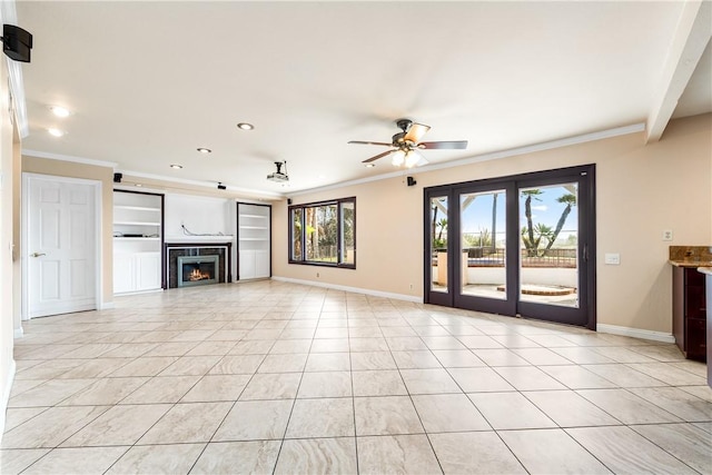 unfurnished living room featuring light tile patterned flooring, ceiling fan, and ornamental molding