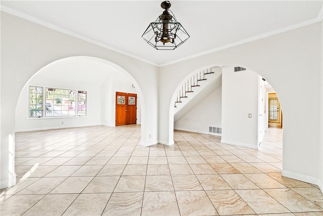 interior space featuring ornamental molding and light tile patterned floors