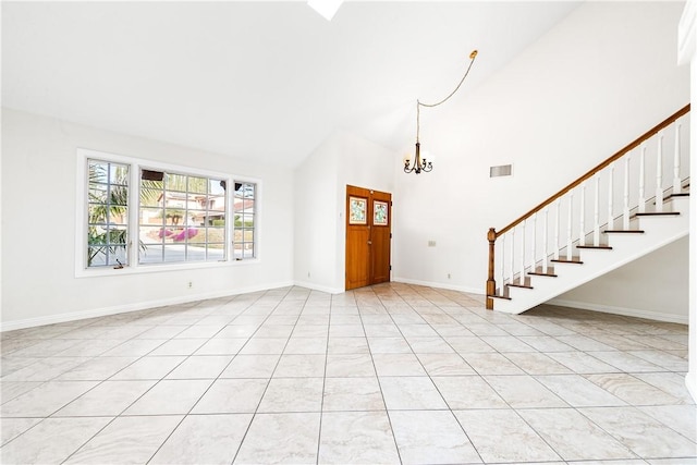 interior space with a notable chandelier and high vaulted ceiling