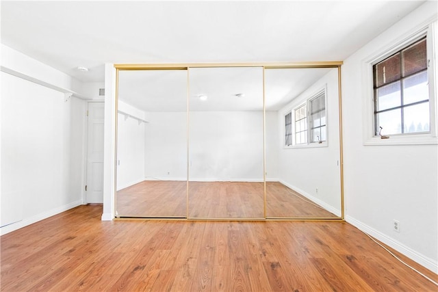 unfurnished bedroom featuring hardwood / wood-style floors