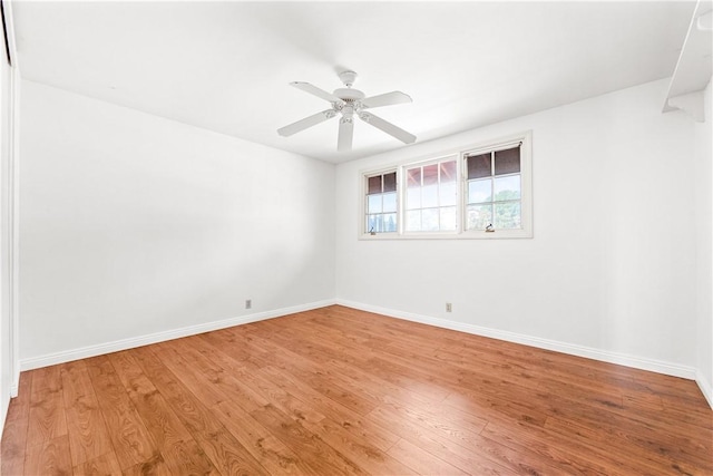 unfurnished room with ceiling fan and light wood-type flooring