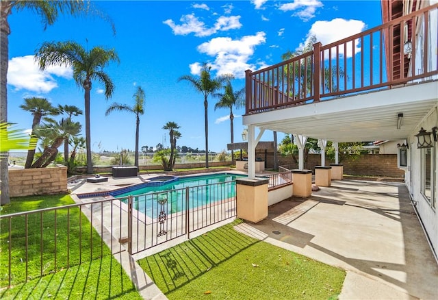 view of swimming pool featuring a patio and a lawn