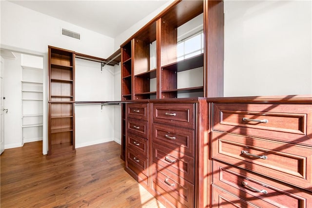 spacious closet with wood-type flooring