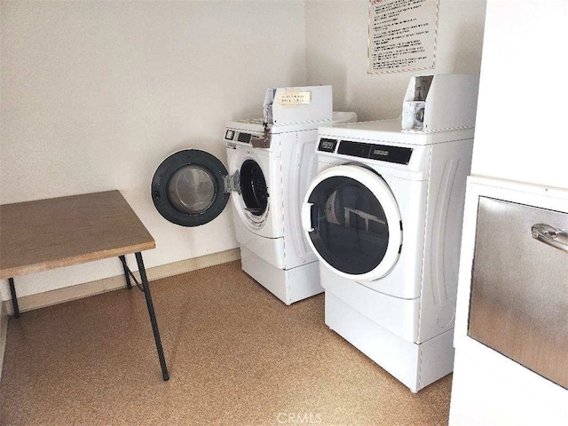 washroom with independent washer and dryer