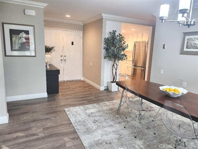 home office with crown molding, dark wood-type flooring, and a chandelier