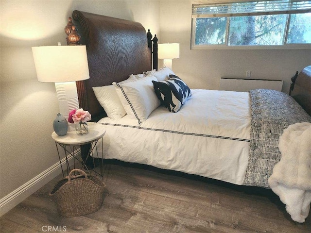 bedroom featuring wood-type flooring