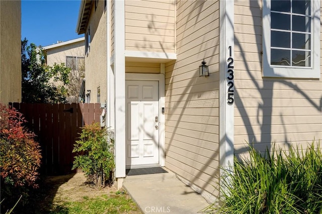 property entrance featuring fence