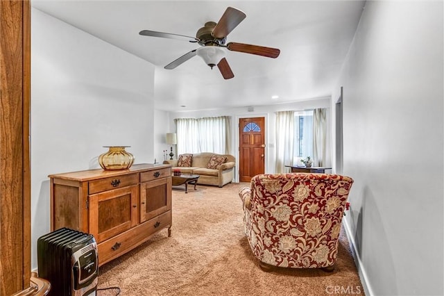 living room with light carpet and ceiling fan