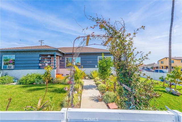 view of front of property with a front lawn and stucco siding