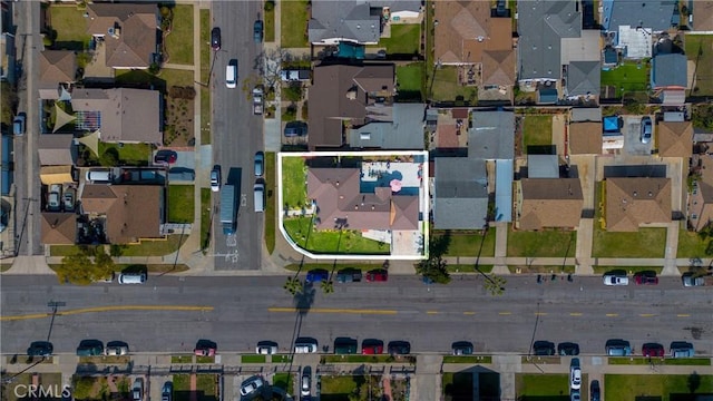 birds eye view of property with a residential view