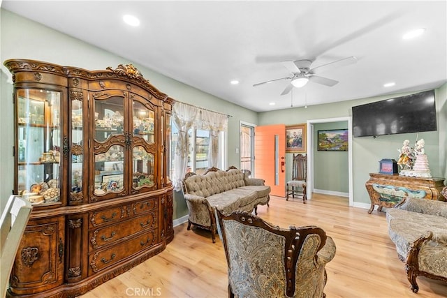 interior space with ceiling fan and light hardwood / wood-style flooring