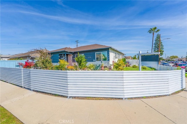 view of front of house featuring fence