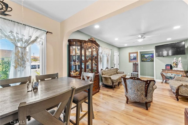 dining room with light hardwood / wood-style flooring and ceiling fan