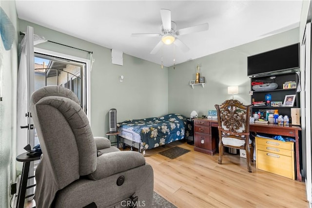 bedroom with hardwood / wood-style floors and ceiling fan