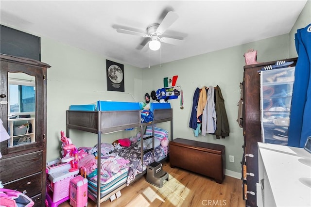 bedroom featuring ceiling fan and light wood-type flooring