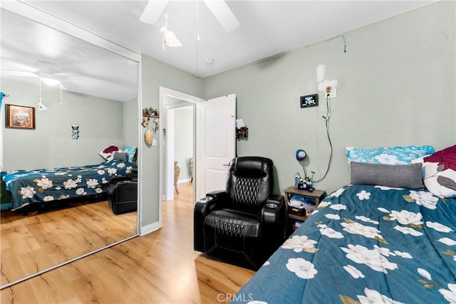 bedroom featuring hardwood / wood-style floors and ceiling fan