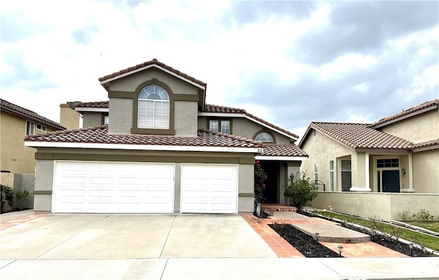 mediterranean / spanish-style home featuring a garage