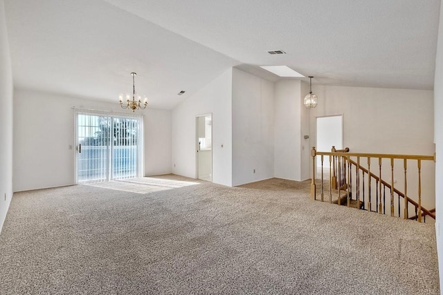 unfurnished room with lofted ceiling, carpet, and a notable chandelier