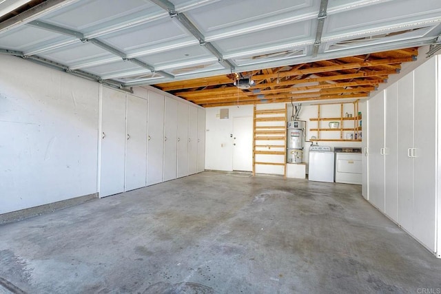 garage with strapped water heater, a garage door opener, and washing machine and dryer