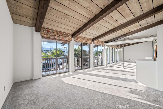 unfurnished sunroom with wood ceiling and lofted ceiling with beams