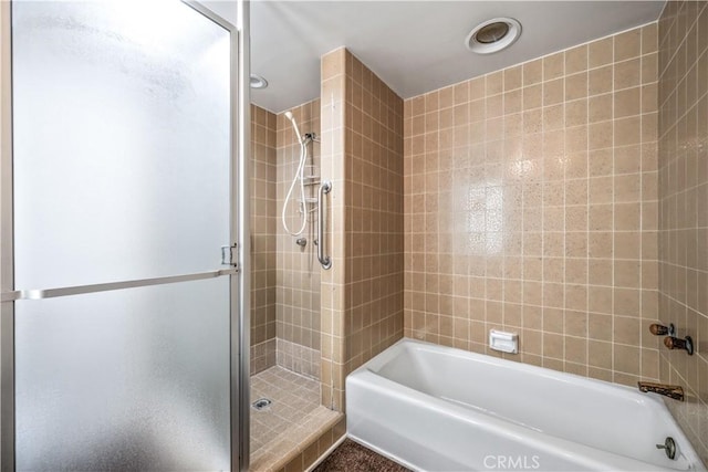 bathroom with separate shower and tub