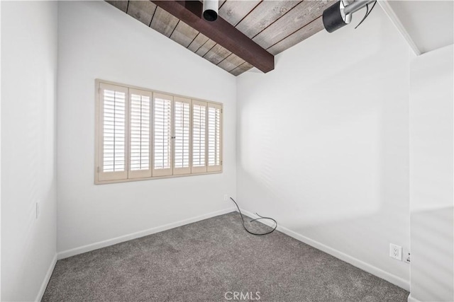 spare room featuring vaulted ceiling with beams, wooden ceiling, and carpet