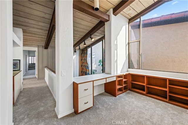 office space with lofted ceiling with beams, light carpet, and wooden ceiling