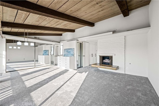 unfurnished living room with wood ceiling, carpet, and vaulted ceiling with beams