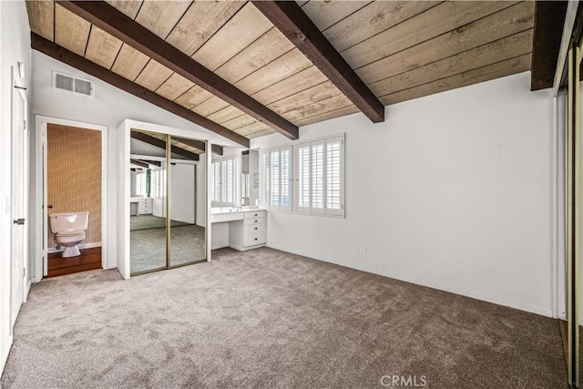 unfurnished bedroom with vaulted ceiling with beams, wooden ceiling, and carpet flooring