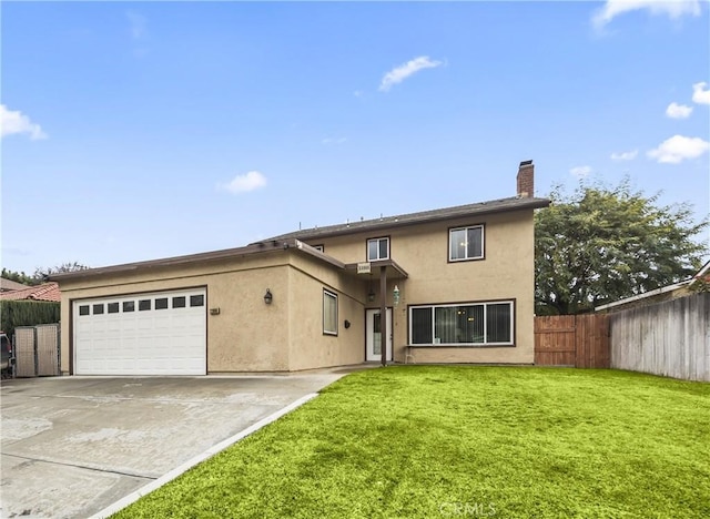 view of front of house with a garage and a front yard