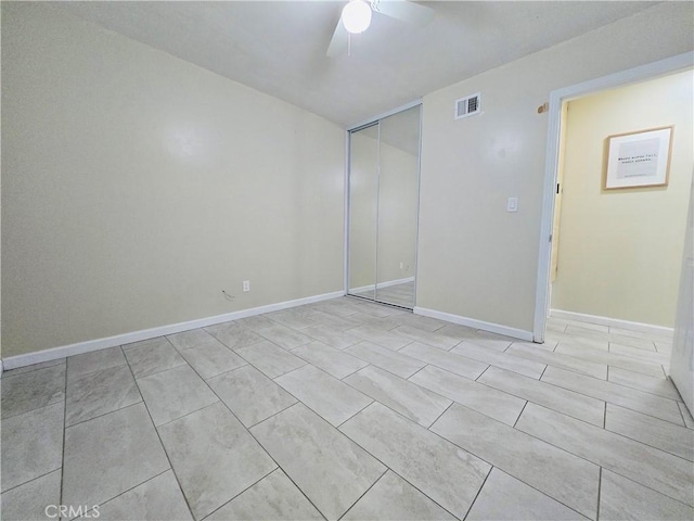 unfurnished bedroom with a closet and ceiling fan