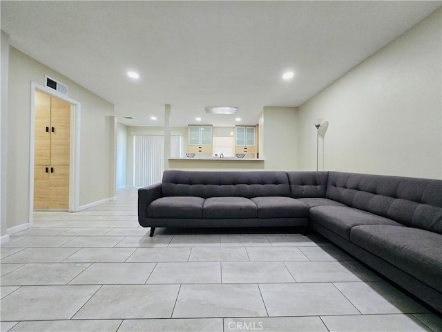 living room with light tile patterned flooring