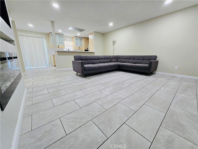 unfurnished living room featuring light tile patterned floors