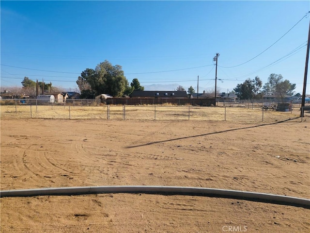 view of yard with a rural view