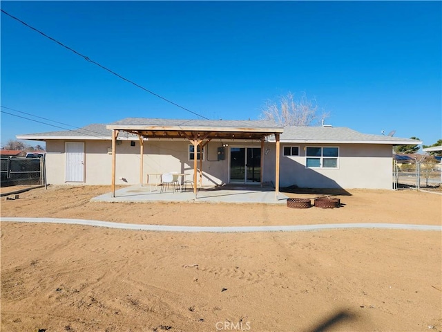 back of house with a patio