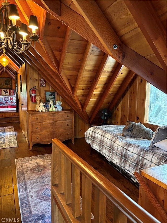 bedroom featuring wooden walls, an inviting chandelier, lofted ceiling with beams, wood-type flooring, and wooden ceiling