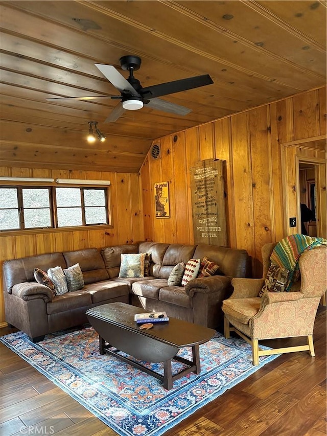 living room featuring lofted ceiling, wood ceiling, wood-type flooring, and wooden walls