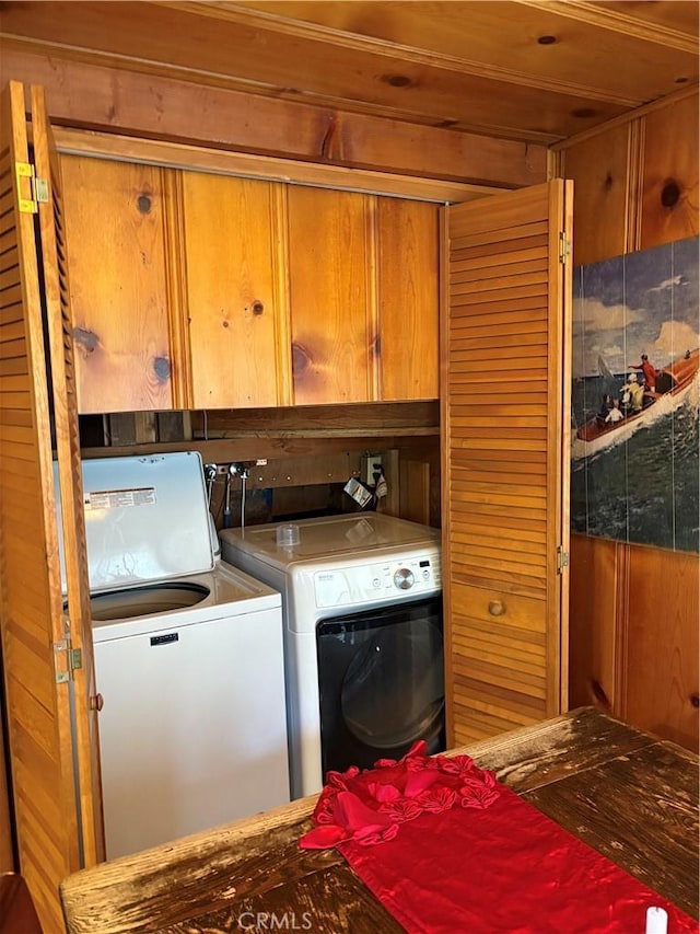 laundry room with cabinets and separate washer and dryer