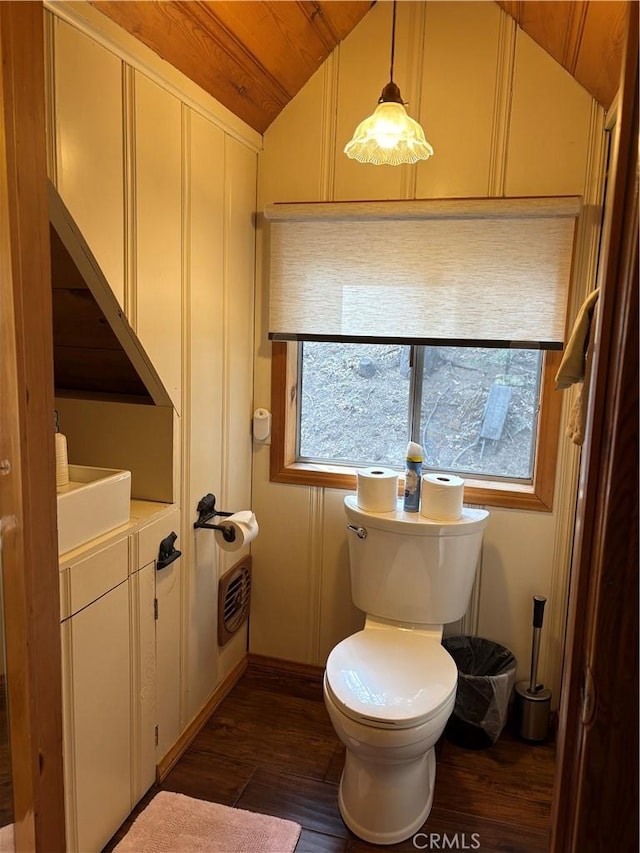 bathroom with lofted ceiling, hardwood / wood-style flooring, vanity, wood ceiling, and toilet