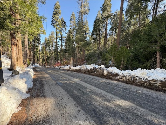 view of road featuring a view of trees