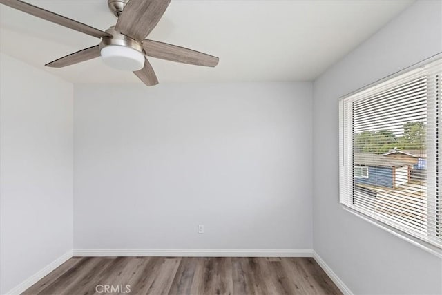 empty room featuring hardwood / wood-style flooring and ceiling fan