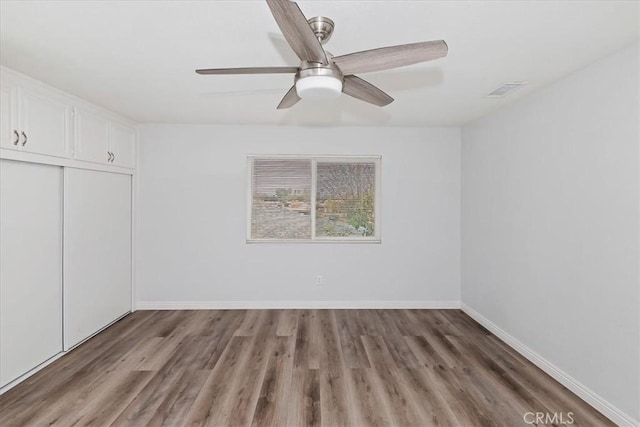 interior space featuring ceiling fan and wood-type flooring