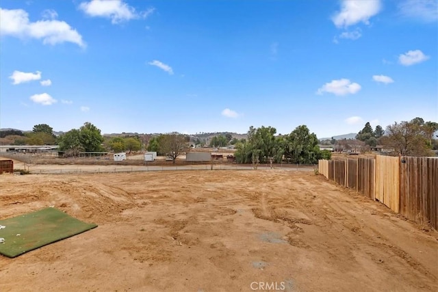 view of yard with a rural view